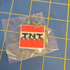 Minecraft TNT block keychain, likely made of silicone or rubber